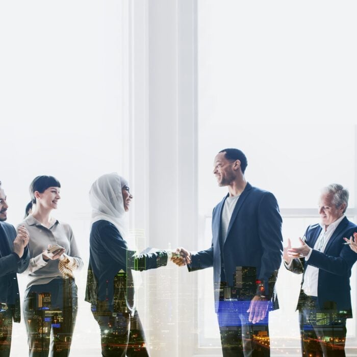 Businesspeople greeting each other with Arabic phrases