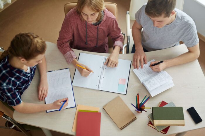 Group of friends studying to get their English certificates