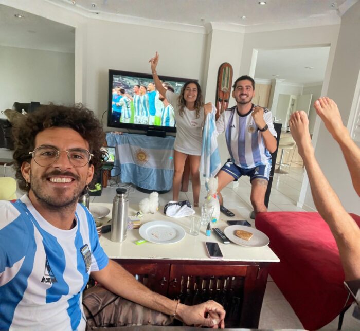 A group of Argentine friends watching the World Cup on TV